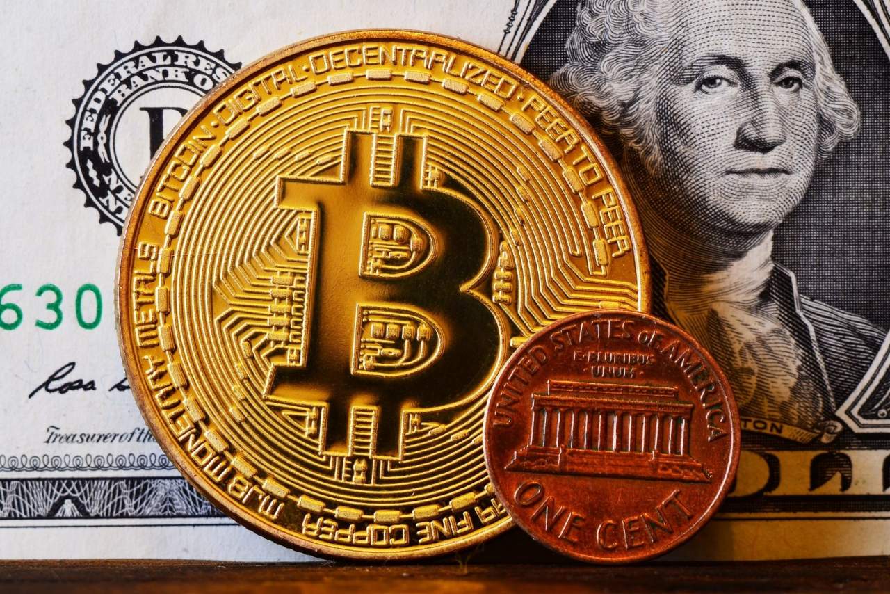 AU 1064. Bitcoins Vs Oro ¿En cuál invertir?